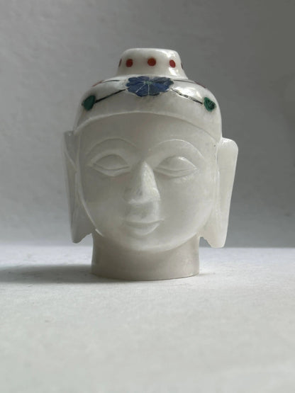 White Marble Buddha head - There is nothing more soothing for your living space than having a Buddha statue as home decor. This particular White marble  example depicts the head of Buddha in his meditative state and has been made using fine marble.