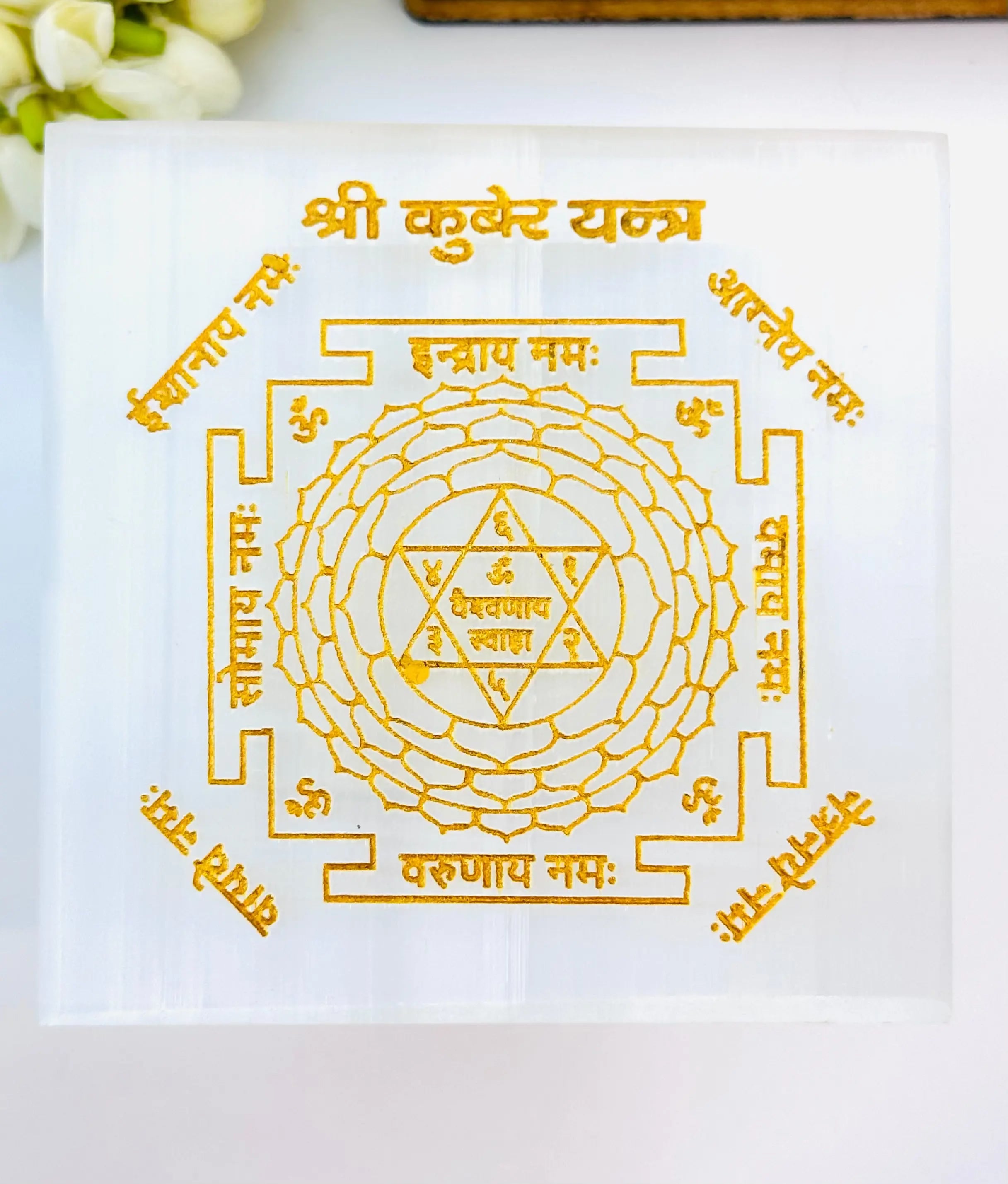 Close-up of Selenite Kuber Yantra with detailed etching