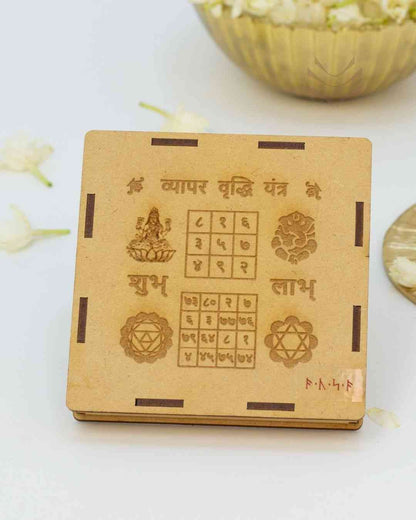 Wooden cover for Vyapar Vridhi Yantra with engraved symbols